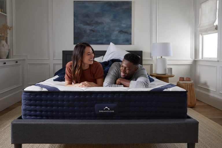 Young couple sleeping on dreamcloud luxury hybrid mattress